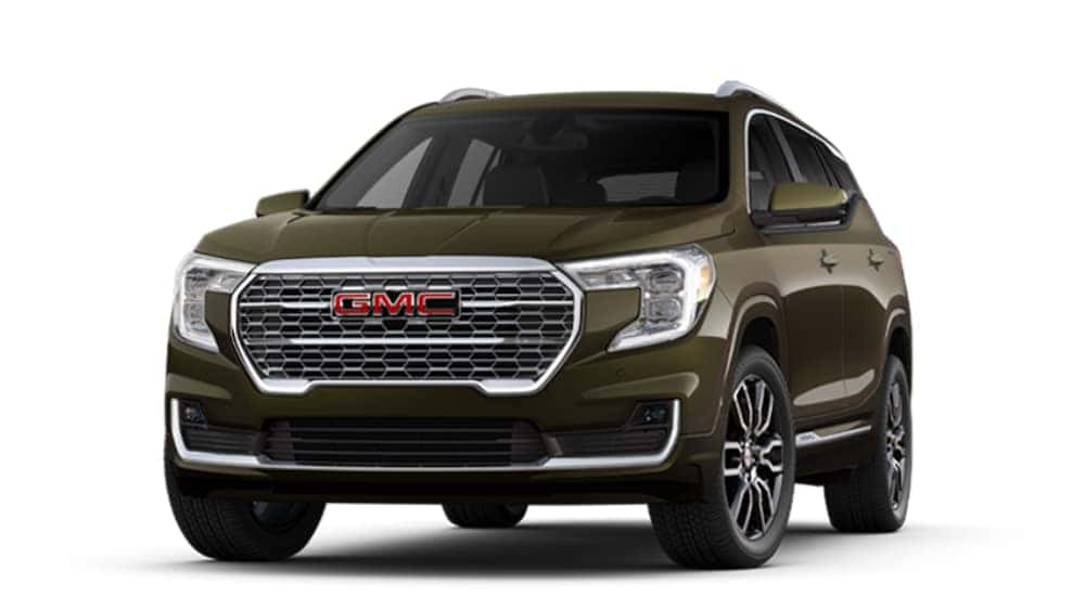 Green GMC SUV with a bold grille and modern design, showcasing sleek lines and alloy wheels.