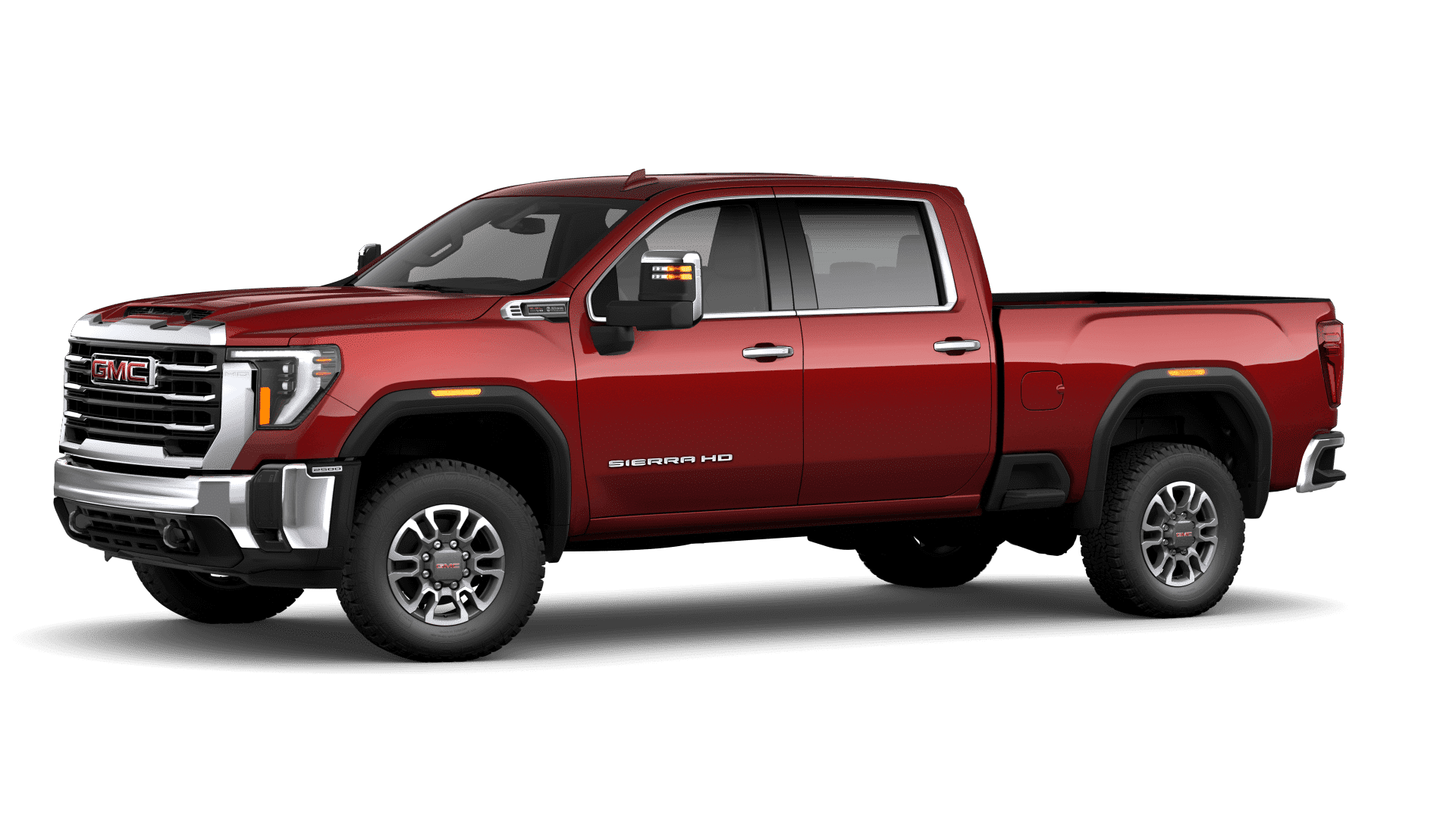Red GMC Sierra HD pickup truck, side view, showcasing robust design and detailing.