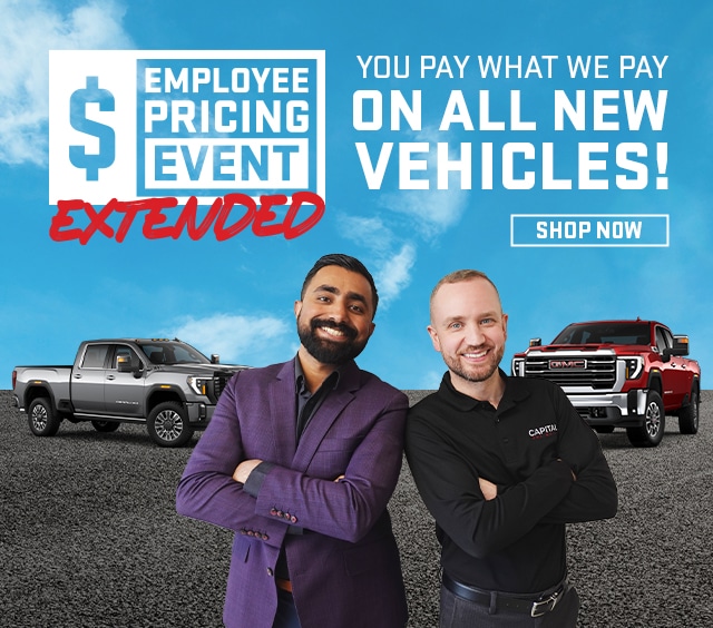 Two men stand in front of trucks promoting "Employee Pricing Event Extended" car sale.