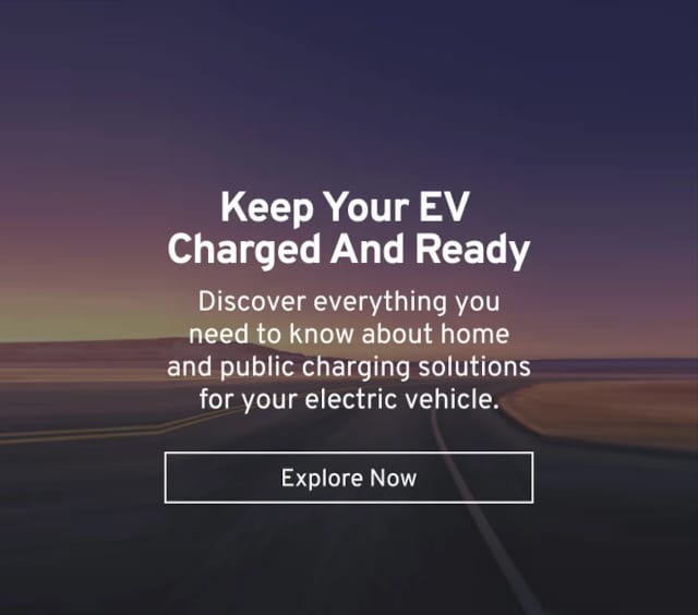 Text about EV charging solutions over a sunset road background with "Explore Now" button.