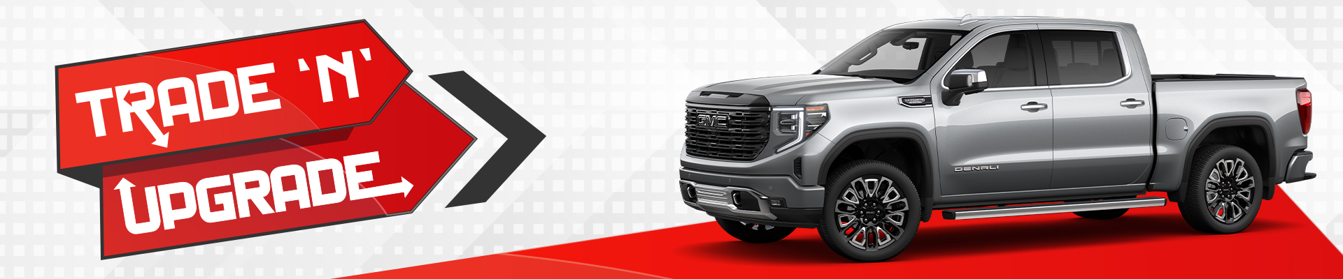 Silver GMC truck on a red arrow backdrop with the text "Trade 'N' Upgrade" in bold.