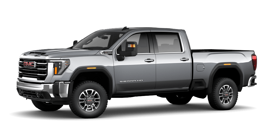Silver heavy-duty pickup truck parked outdoors.