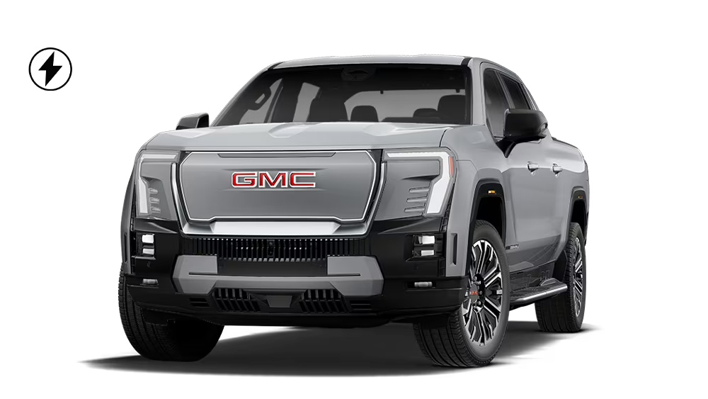 Light blue GMC truck with bold grille and rugged design, showcasing off-road capabilities.