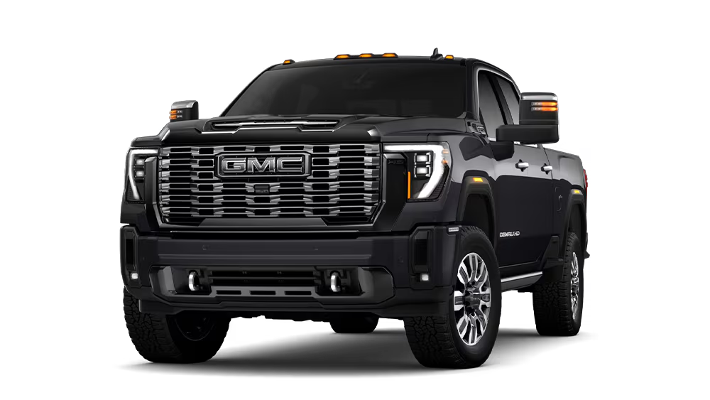 Black GMC Denali pickup truck, front view, showcasing grille and headlight design.