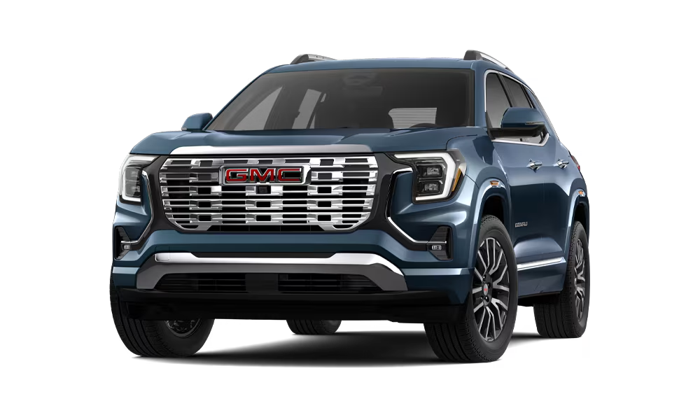 Green GMC SUV with a bold grille and modern design, showcasing sleek lines and alloy wheels.