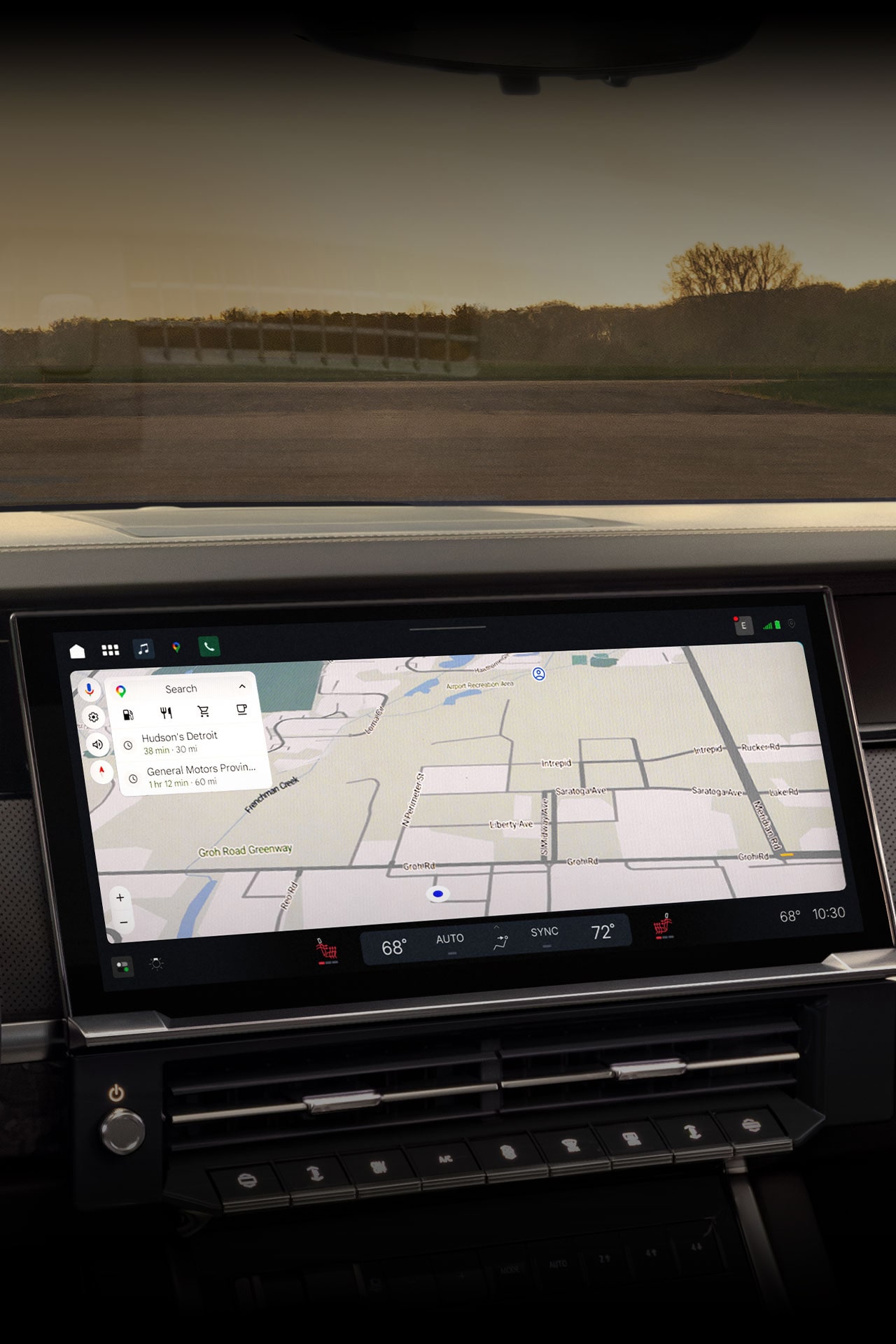 In-car navigation screen displaying a map and directions, alongside climate control settings.