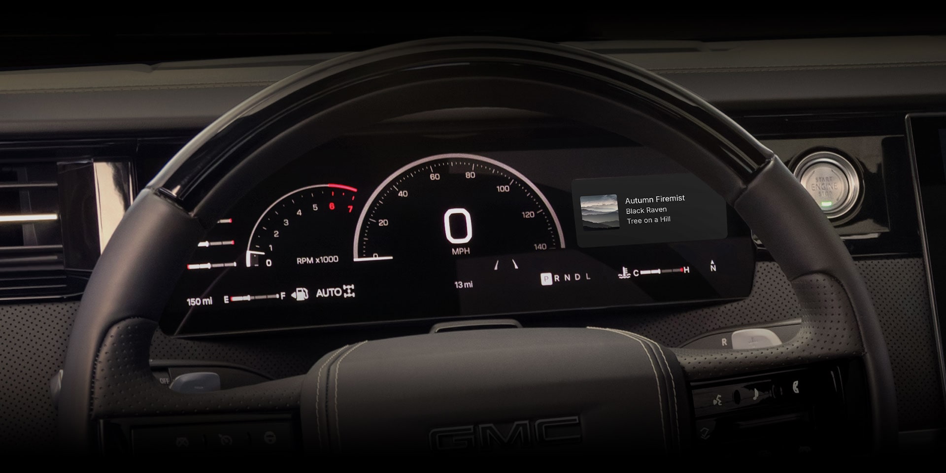 GMC digital dashboard showing speedometer, RPM gauge, and audio track info for "Autumn Firemist."
