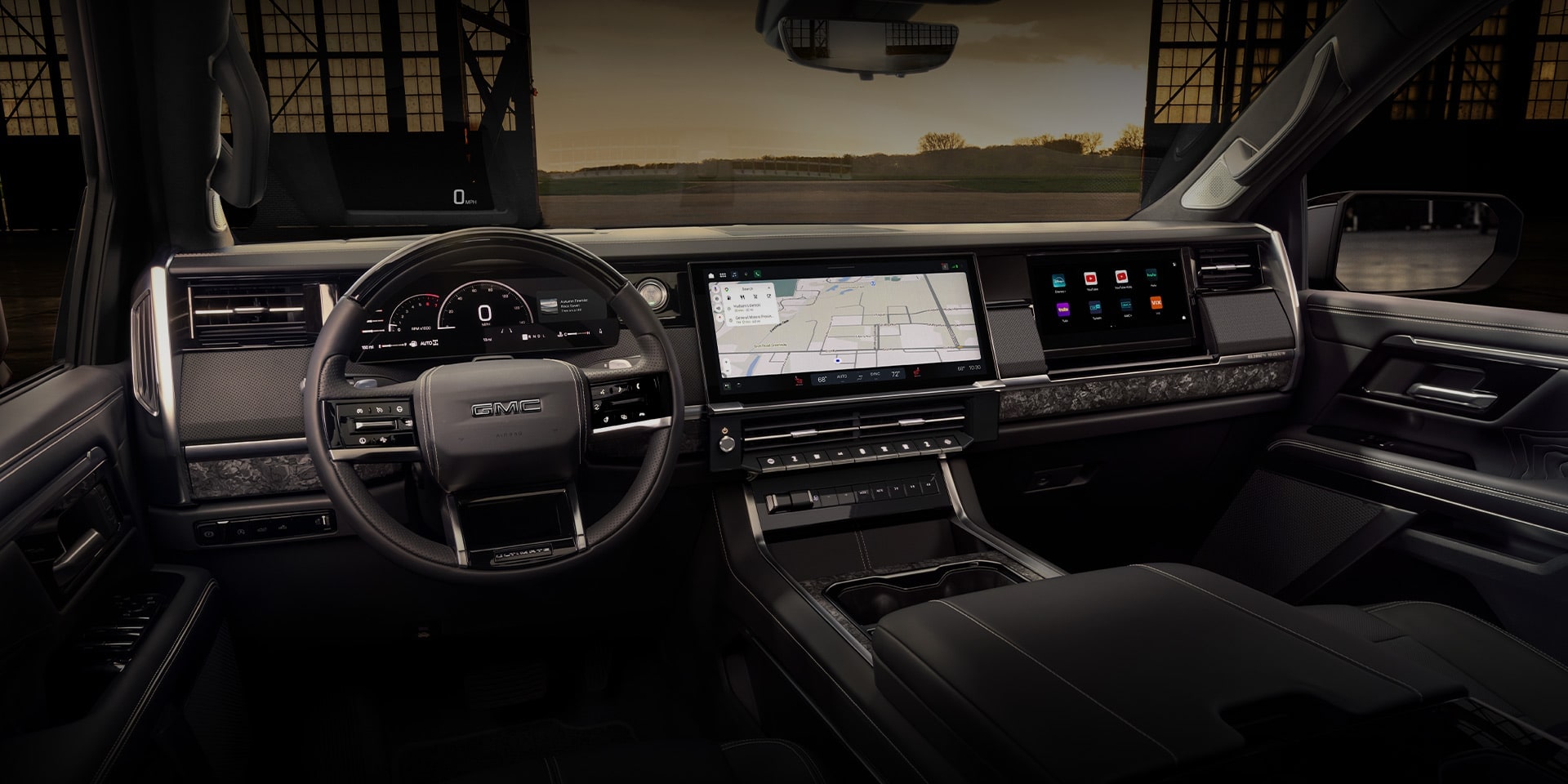 Luxury vehicle interior featuring a digital dashboard, steering wheel, and touchscreen display.
